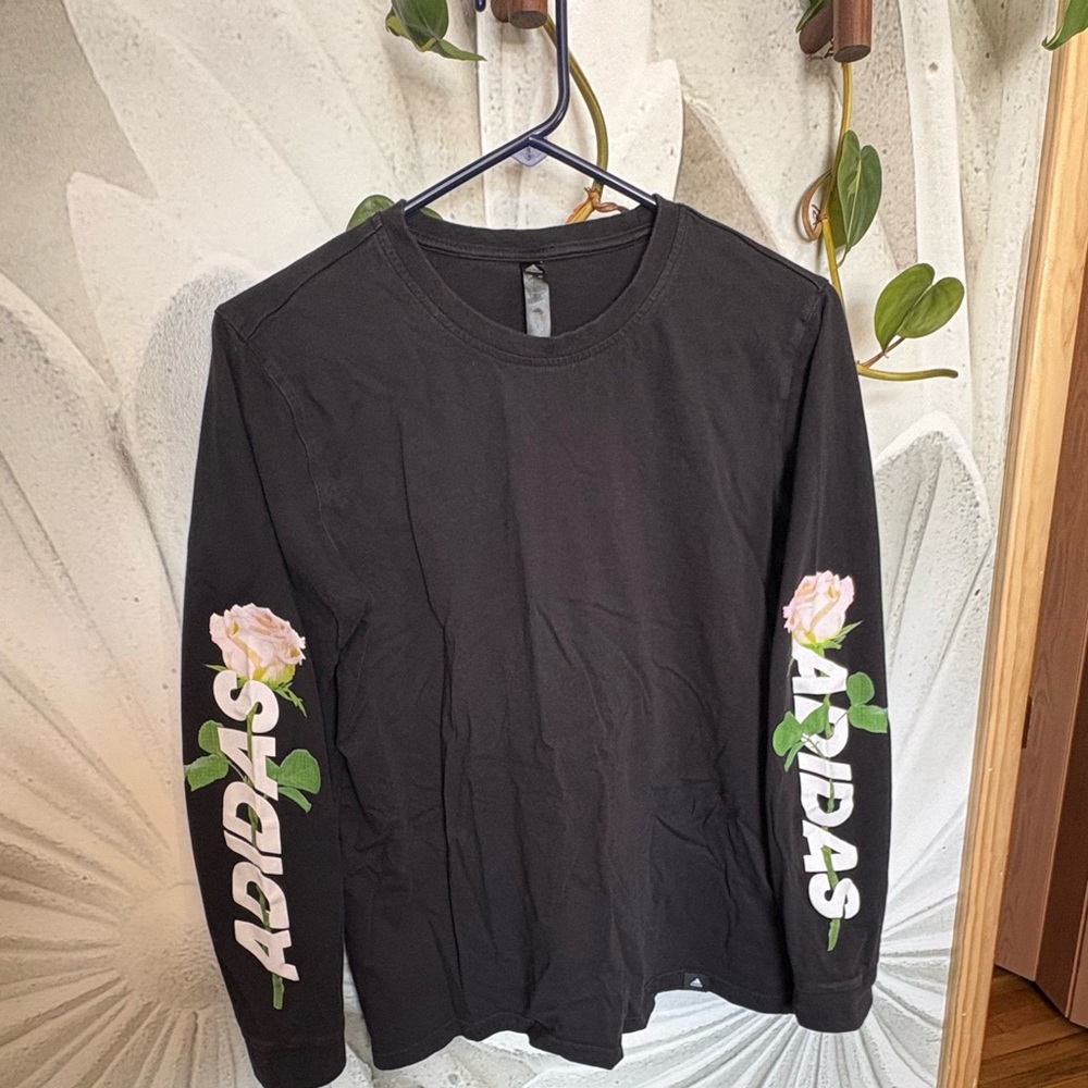 Women’s large Adidas black long sleeved shirt rose on sleeves. Smoke free home.